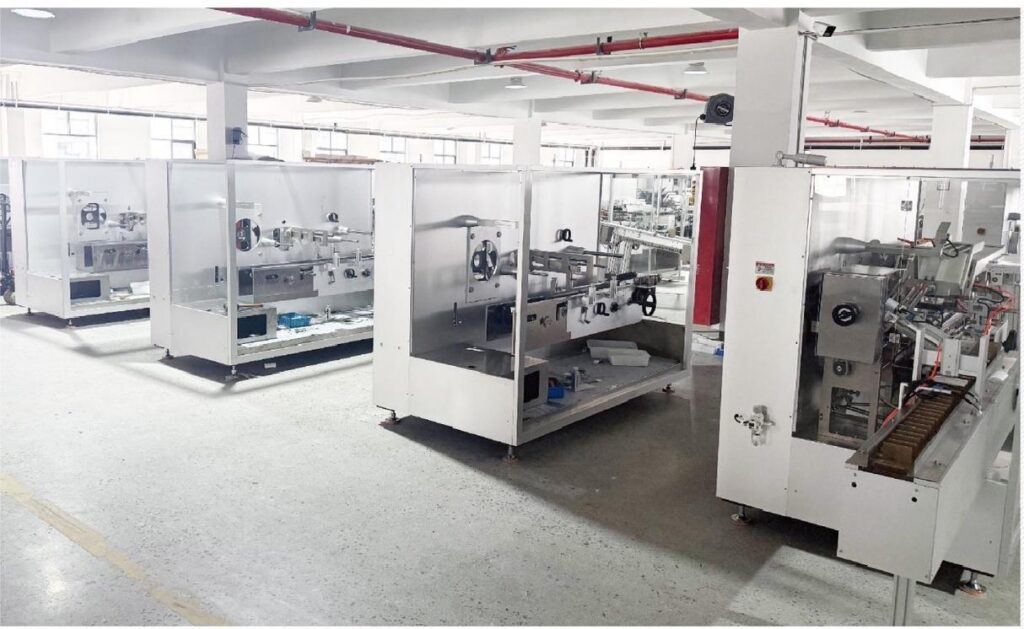 JCH200 high-speed cartoning machines lined up in the assembly workshop