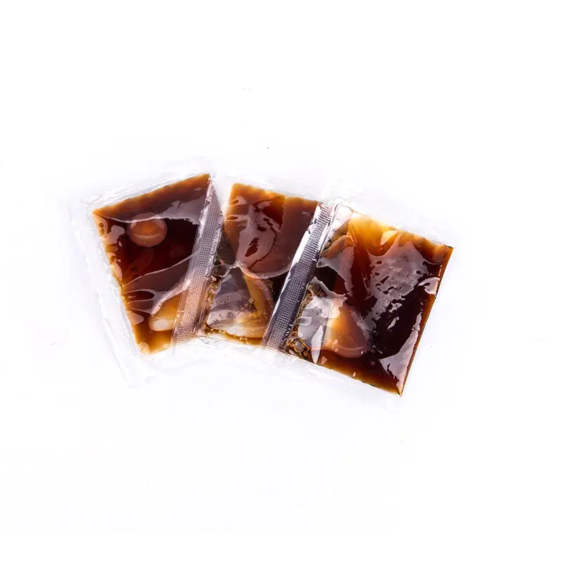 Three-side-seal soy sauce sachet filled by a piston filler